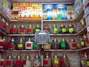 The wall of a small apothecary in Cairo selling herbs, spices, and oils for various ailments.